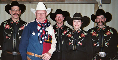 Ron Wilson, Cowboy Poet Lariat poses with Judy Coder and Pride of the Prairie.  